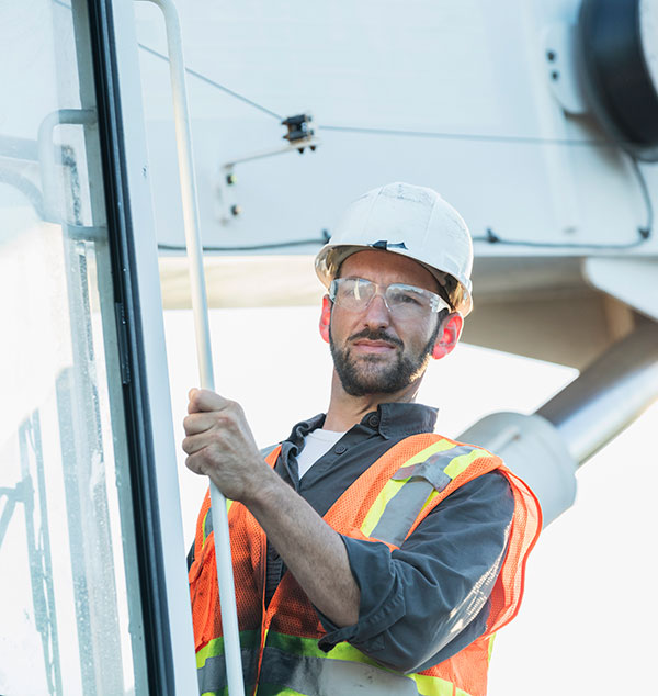 Crane Operator outside cab of mobile crane