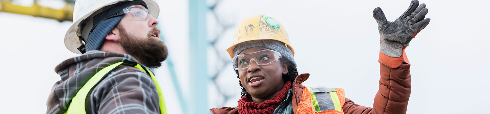 crane apprentice discussing with mentor