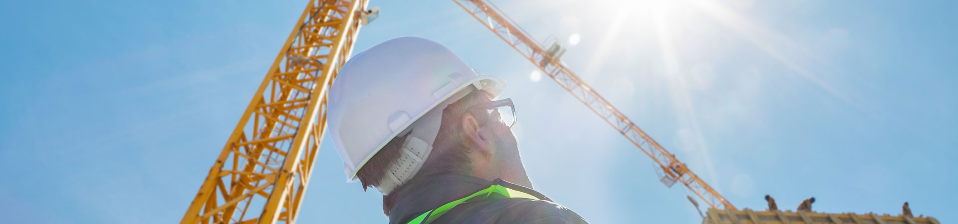 Heat Stress Crane operator looking up at a crane on a hot sunny day