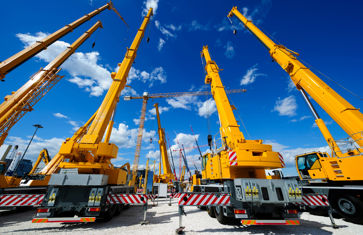 Mobile construction cranes with yellow telescopic arms and big t BC Crane Safety Banner Image